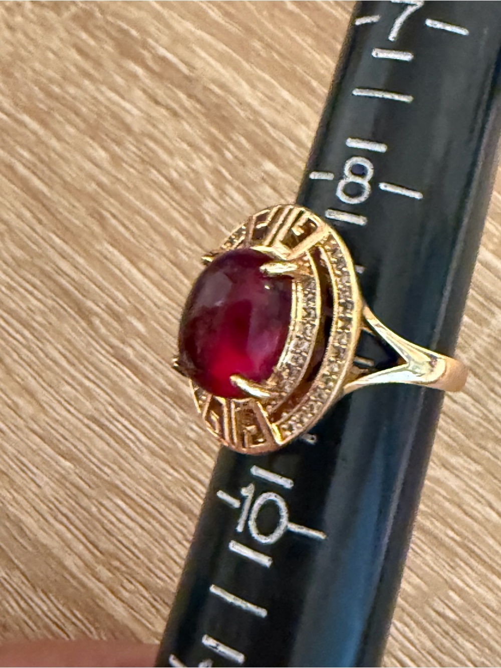 Gold Ring with Deep Red Cabochon and Pavé Accents
